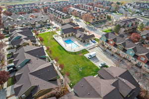 Aerial view of residential area featuring a pool area