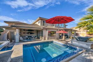 Outdoor pool featuring a patio, outdoor lounge area, and a jacuzzi