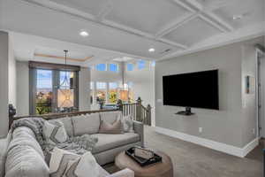 Living area featuring carpet floors and recessed lighting