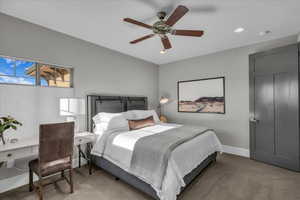 Bedroom featuring light carpet, a ceiling fan, and recessed lighting