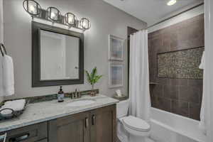 Full bath with vanity and shower / bath combination with curtain