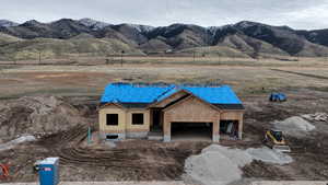 View of front facade with a rural view and a mountain view
