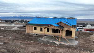 Rear view of house with a mountain view and a residential view