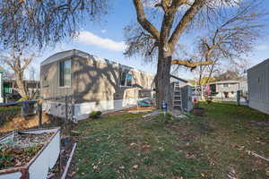 Rear view of house with a garden