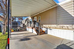 View of patio with a shed and an attached carport