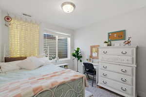 Bedroom featuring carpet flooring
