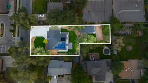 Aerial view of residential area featuring property boundaries highlighted