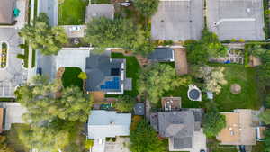 Aerial view of property and surrounding area with nearby suburban area
