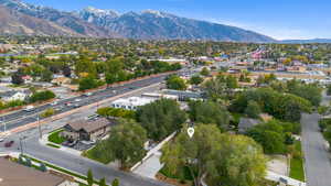 Aerial view of residential area featuring a mountainous background