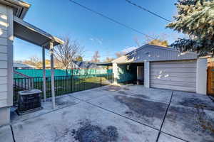 Detached garage with concrete driveway