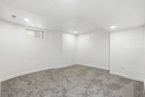 Below grade area with carpet and recessed lighting