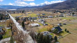 View of property location with mountains and nearby suburban area