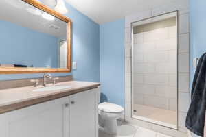 Bathroom with vanity and walk in shower