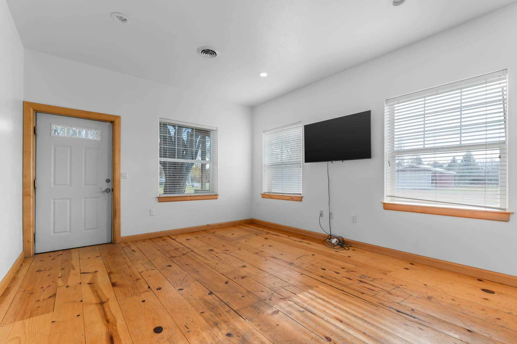 Entryway featuring light wood finished floors and recessed lighting