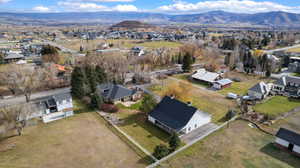 View of property location featuring nearby suburban area and mountains