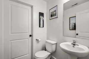 Bathroom featuring toilet and a sink