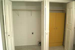Laundry area with hookup for an electric dryer and baseboards