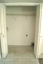 Laundry area featuring electric dryer hookup and wood tiled floors