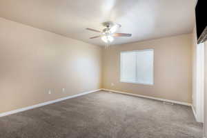 Unfurnished room with carpet floors and ceiling fan
