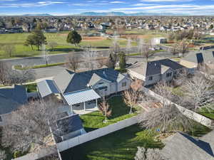 Aerial perspective of suburban area with a mountain backdrop