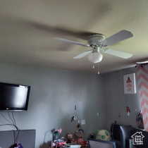 Bedroom featuring a ceiling fan
