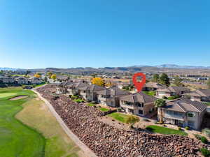 Aerial perspective of suburban area featuring a mountain backdrop
