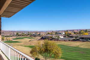 Balcony with view of golf course and a residential view