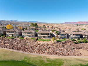 View of mountain backdrop featuring nearby suburban area