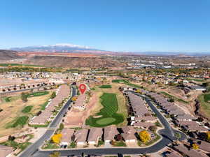 View of property location with a golf club and nearby suburban area