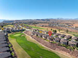 View of property location featuring nearby suburban area and a local golf course