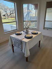 Dining/Sunroom highlighting wall to wall windows bringing natural sunlight and creating pristine views of the Wasatch Front namely Malan’s Peak