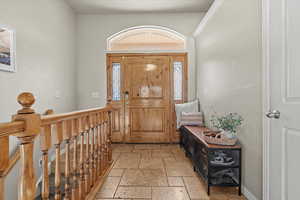 Entrance foyer with stone tile floors