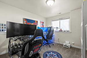 Carpeted office featuring baseboards