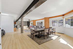 Dining area featuring a ceiling fan, light wood-style flooring, and healthy amount of natural light