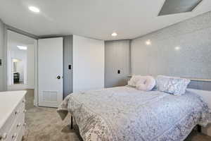 Bedroom featuring light colored carpet and recessed lighting