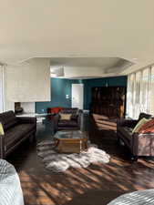Living room featuring plenty of natural light and floor to ceiling windows