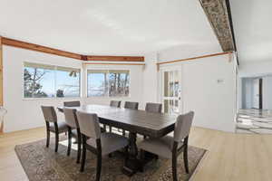 Dining area with light wood-style flooring