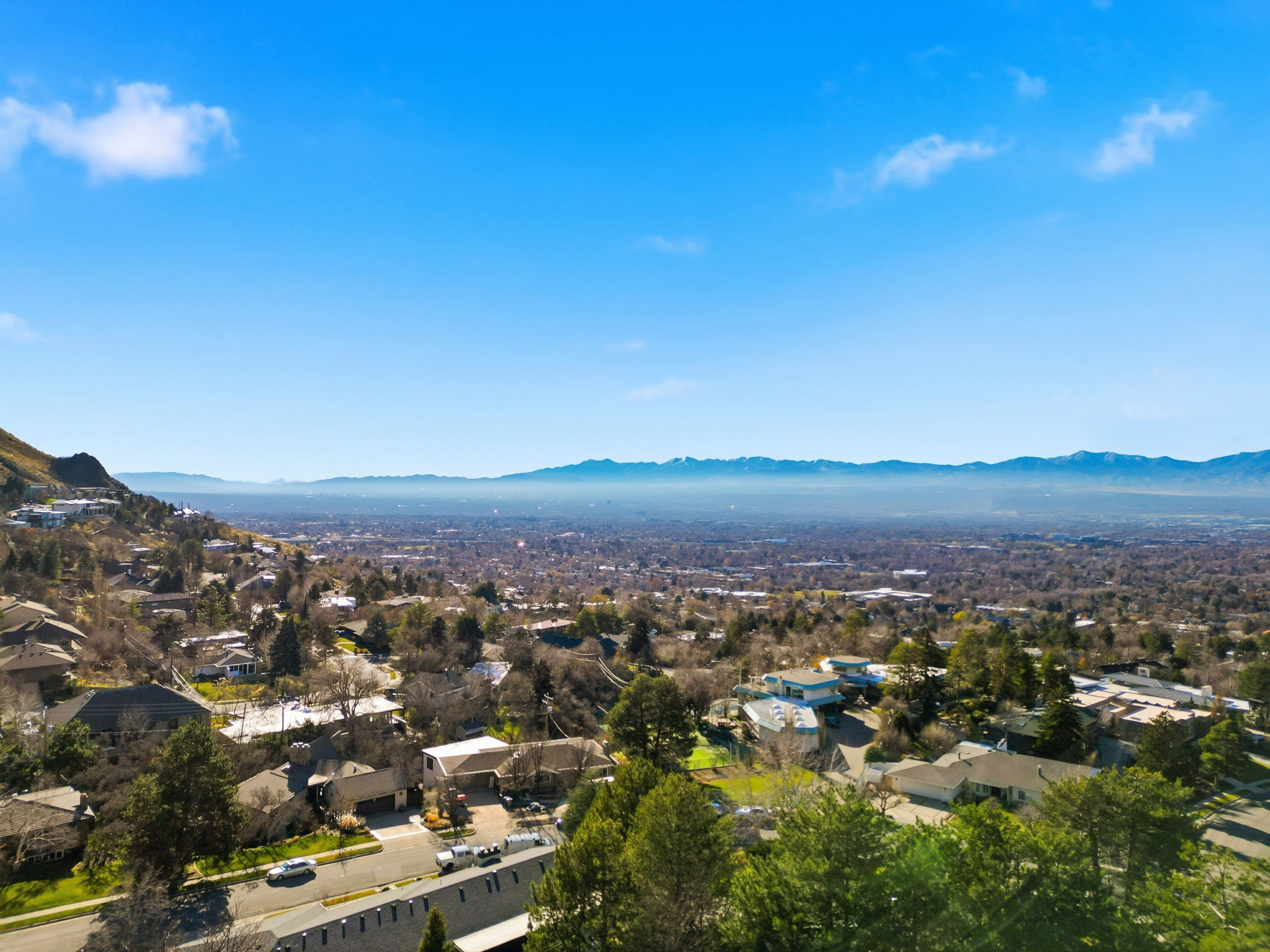 View of property location with a mountainous background and nearby suburban area