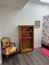 Living area featuring wood finished floors and baseboards