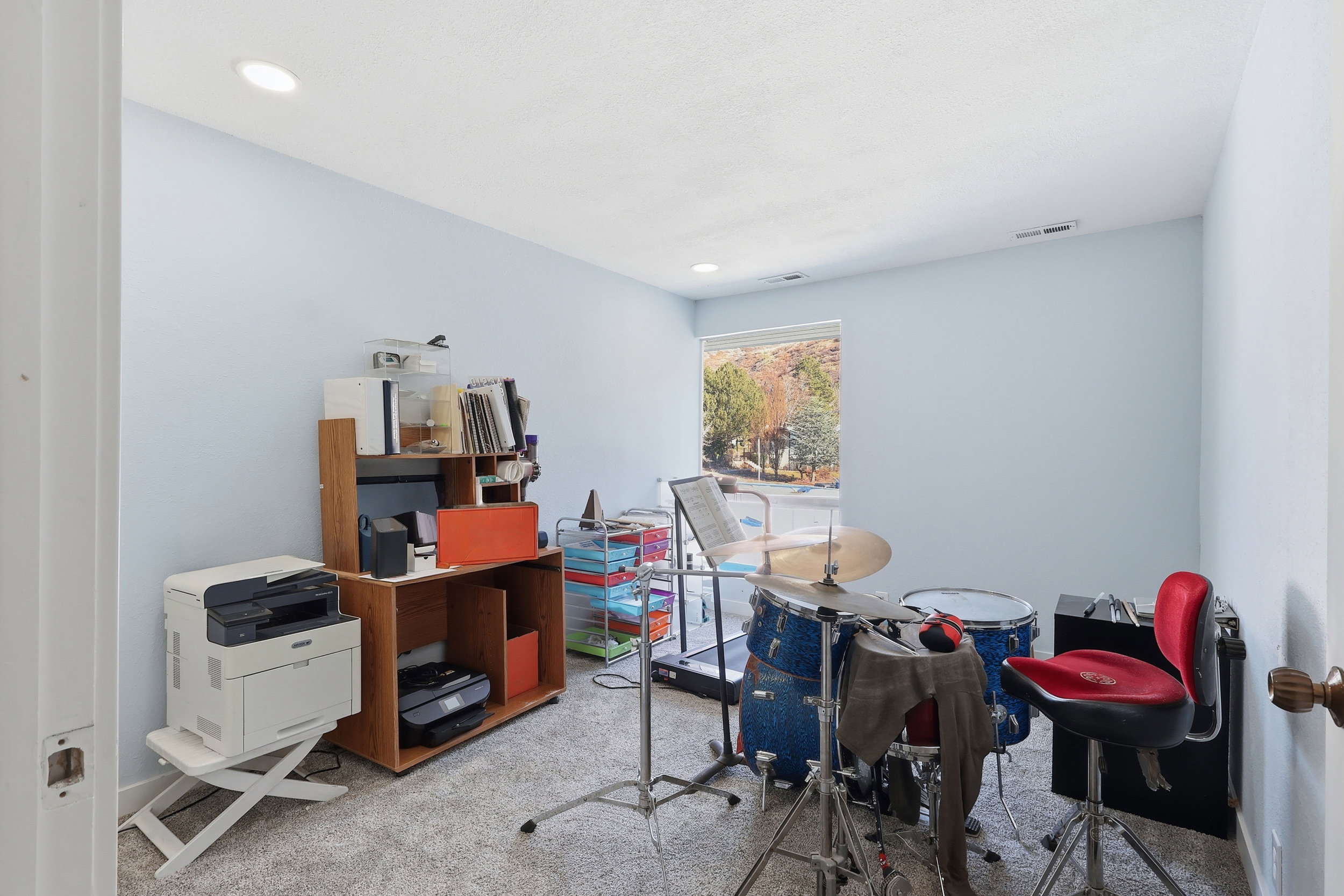 Carpeted office space featuring recessed lighting