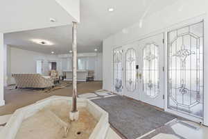 Foyer entrance featuring french doors and recessed lighting