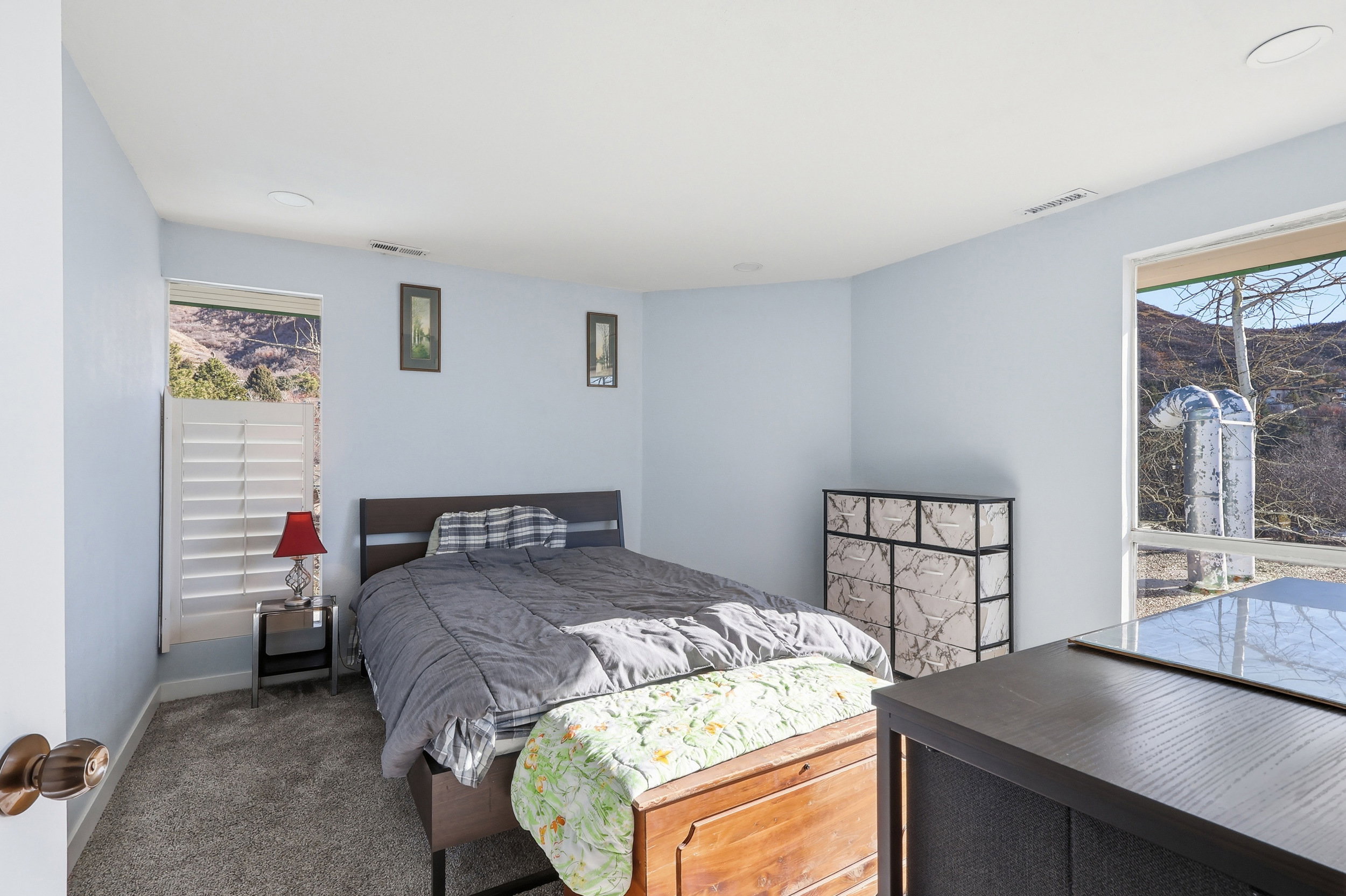 Carpeted bedroom with baseboards