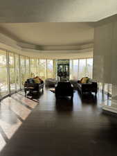 Sunroom / solarium with wood finished floors