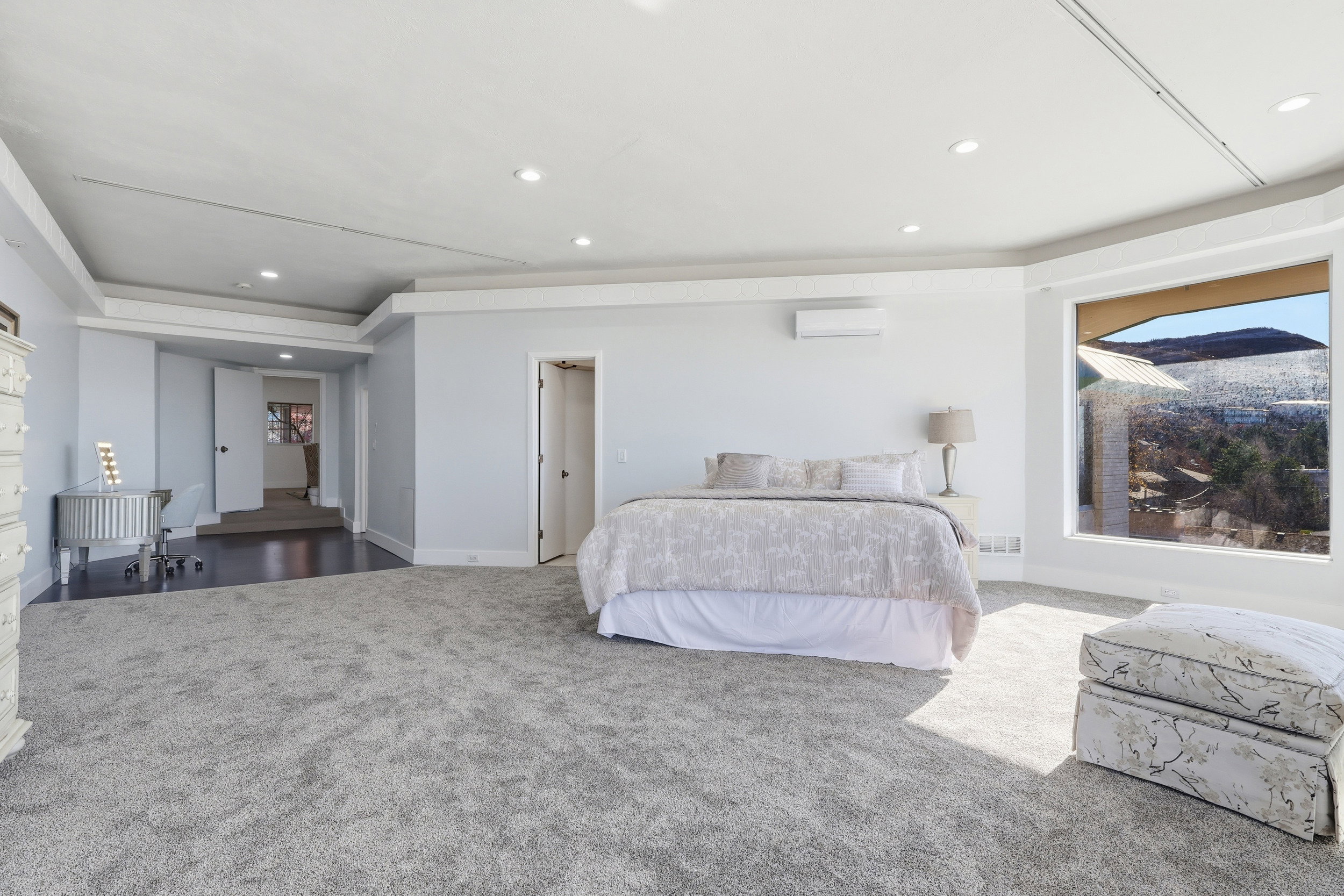 Bedroom featuring carpet floors, recessed lighting, and a wall mounted AC