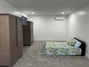 Bedroom featuring light colored carpet and recessed lighting