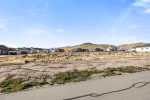 View of mountain backdrop featuring nearby suburban area
