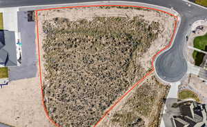 Aerial view of property's location featuring property parcel outlined and a desert landscape