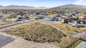 View of mountain backdrop featuring nearby suburban area