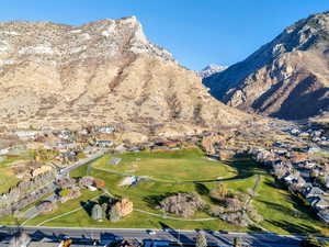 View of mountain backdrop featuring nearby suburban area