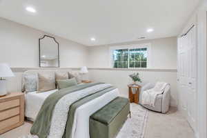 Carpeted bedroom with a closet and recessed lighting